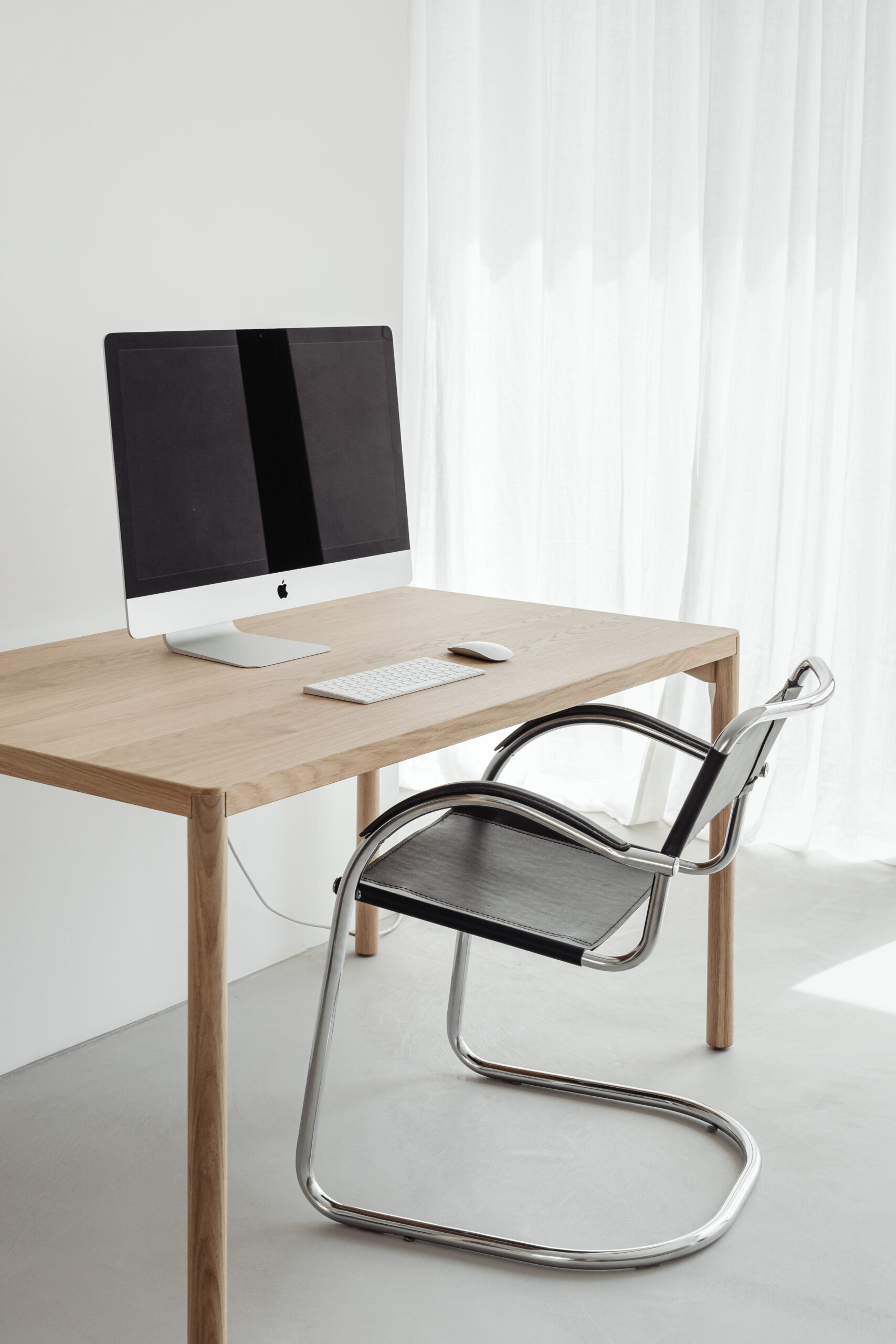 Minimalist desk set-up for a work from home employee.